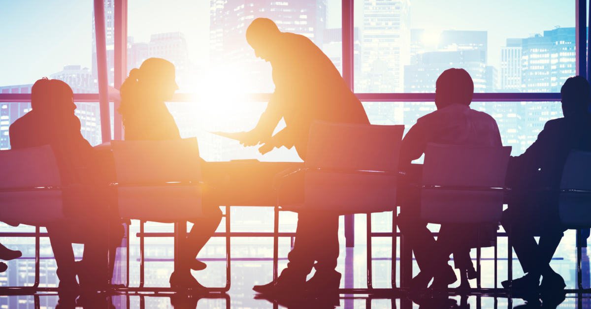 Silhouette of business people in conference room